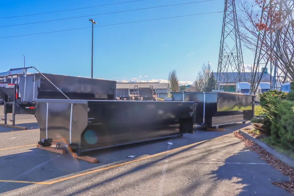 Roll-off dumpster ready for waste disposal at job site for 15 Yard Dumpster Rental in Polson